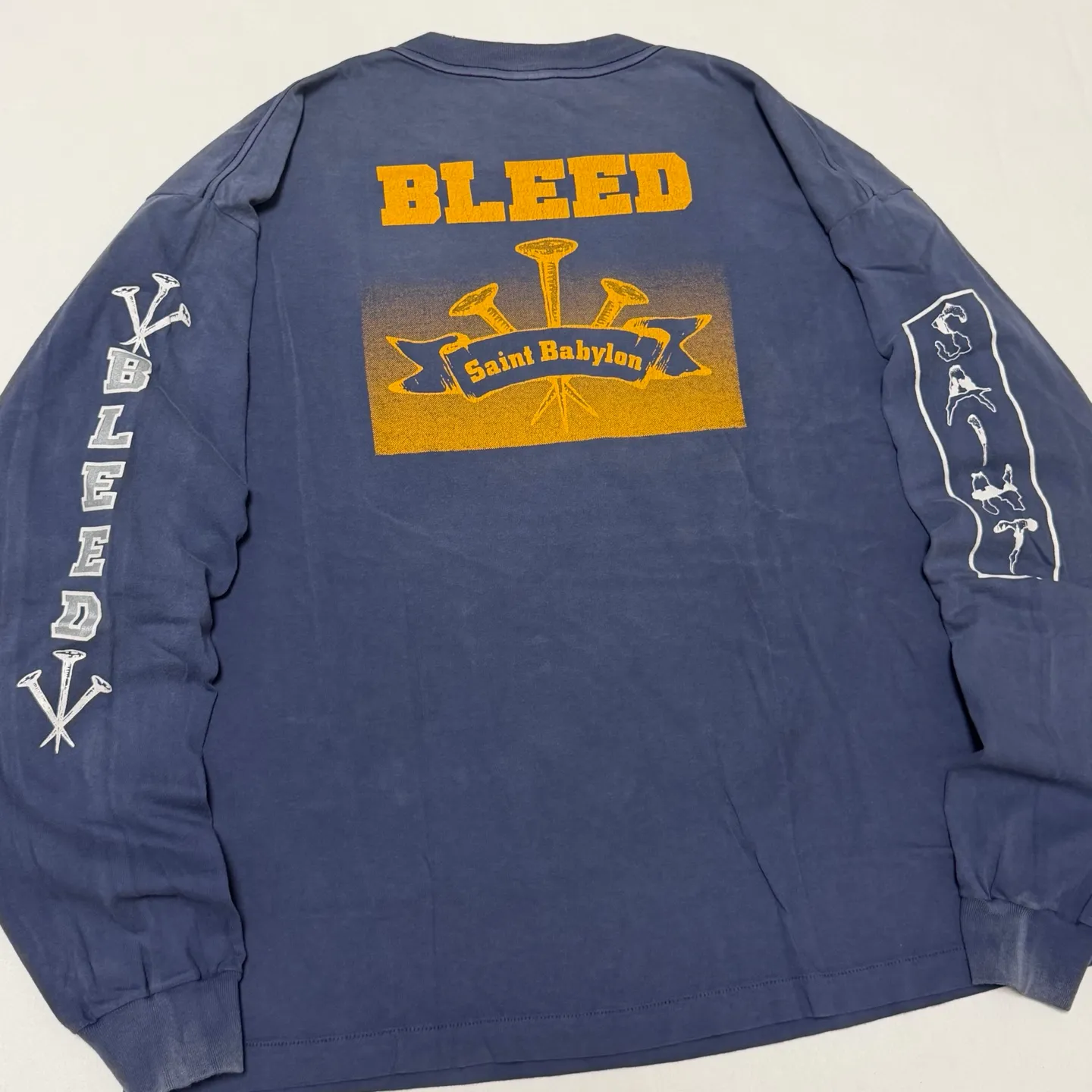 SAINT Mxxxxxx × BABYLON BBLN_LS TEE/SAINT BABYLON/NVY/BABYLON co-branded style Wolf head SAINT/nail distressed long sleeves Washed blue S-XL Completely matched Tube weaving fabric without side seams Garment dyeing Maliu water faded distressing Simulated sun fading treatment Natural fading Handmade holes and frayed Ink splashing treatment Correct main mark/wash mark/little angel anti-counterfeiting mark